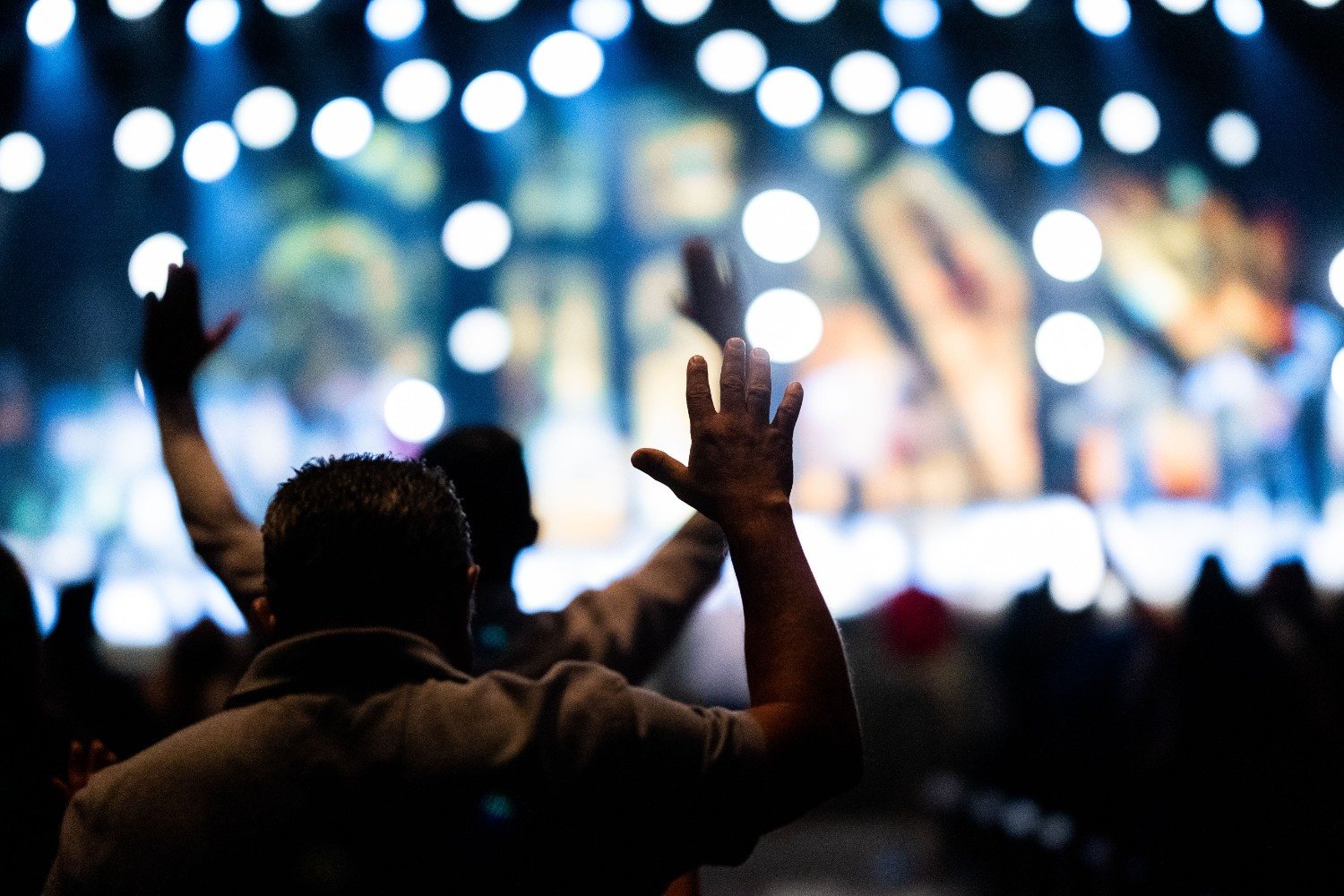 A worshipper raising hands in praise